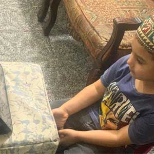 Boy with Quran Recitation 