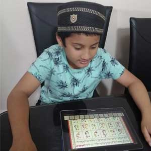 boy reading qaida