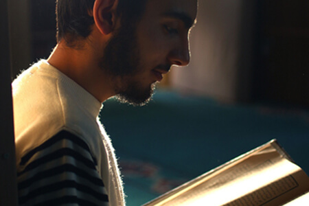 Quran with muslim kid